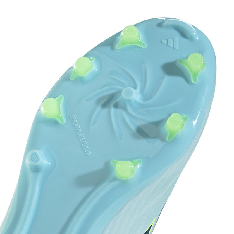 Close-up of youth cleat outsole with molded studs in light blue and lime accents