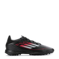 Men's black soccer cleat with red graphic stripes and textured grip sole