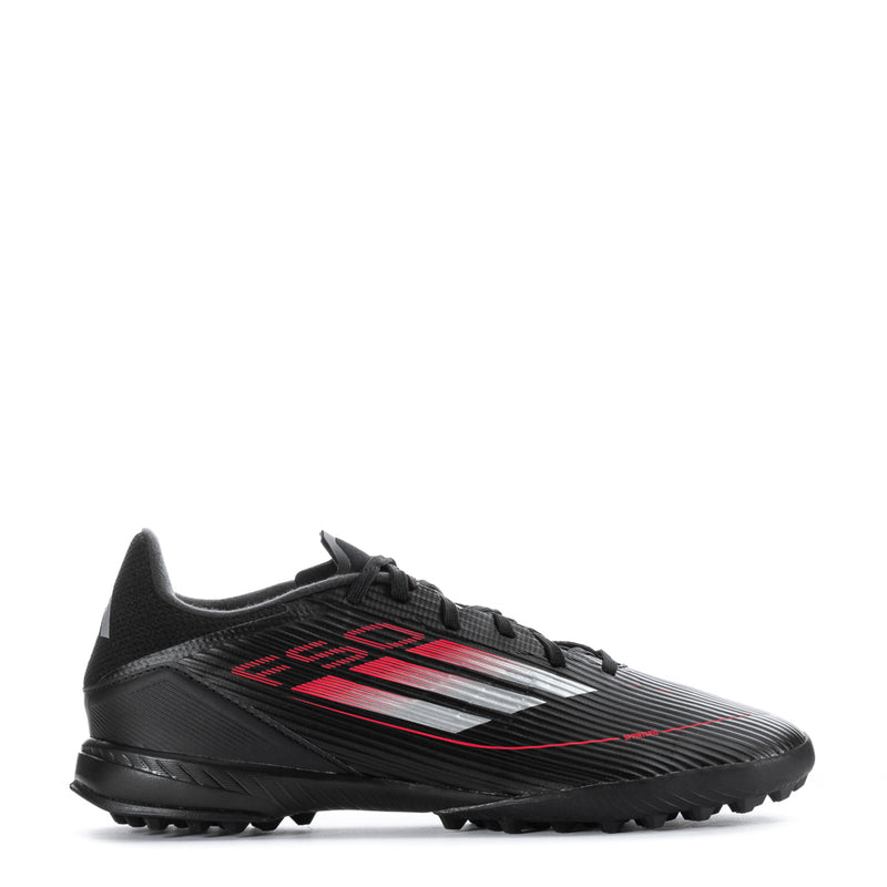Men's black soccer cleat with red graphic stripes and textured grip sole