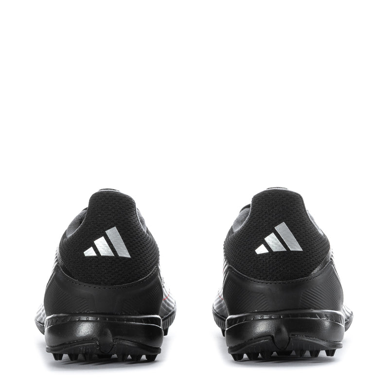 Men's black soccer cleats heel view with contrast logo on back and tread sole