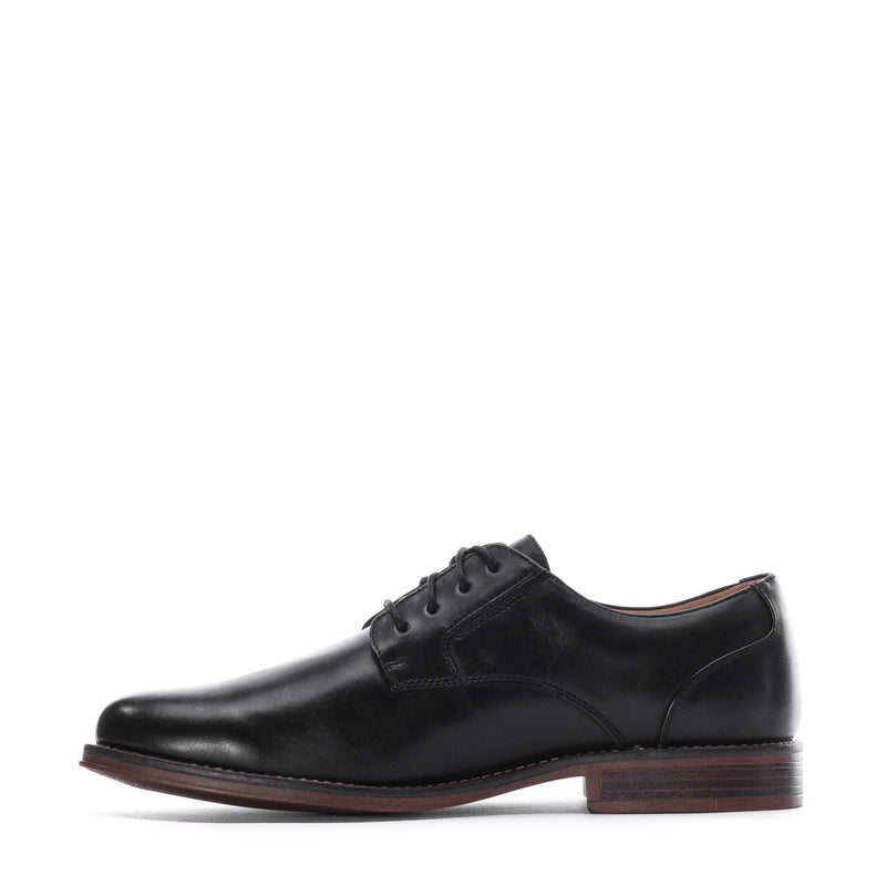 Men's black leather lace-up oxford shoe, side profile with brown outsole