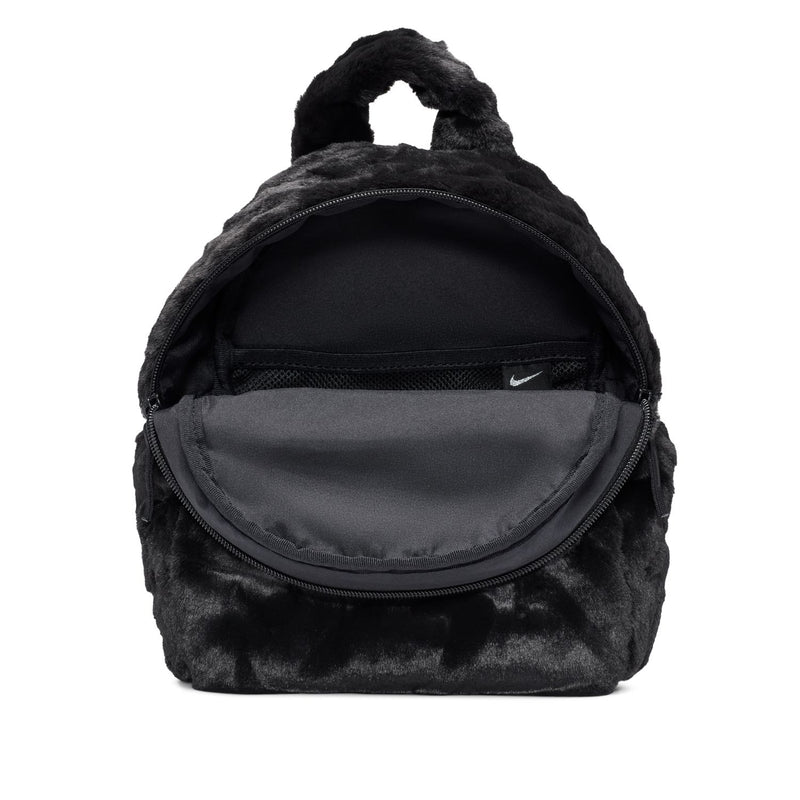 Black faux fur mini backpack with front zip pocket and inner Nike logo.