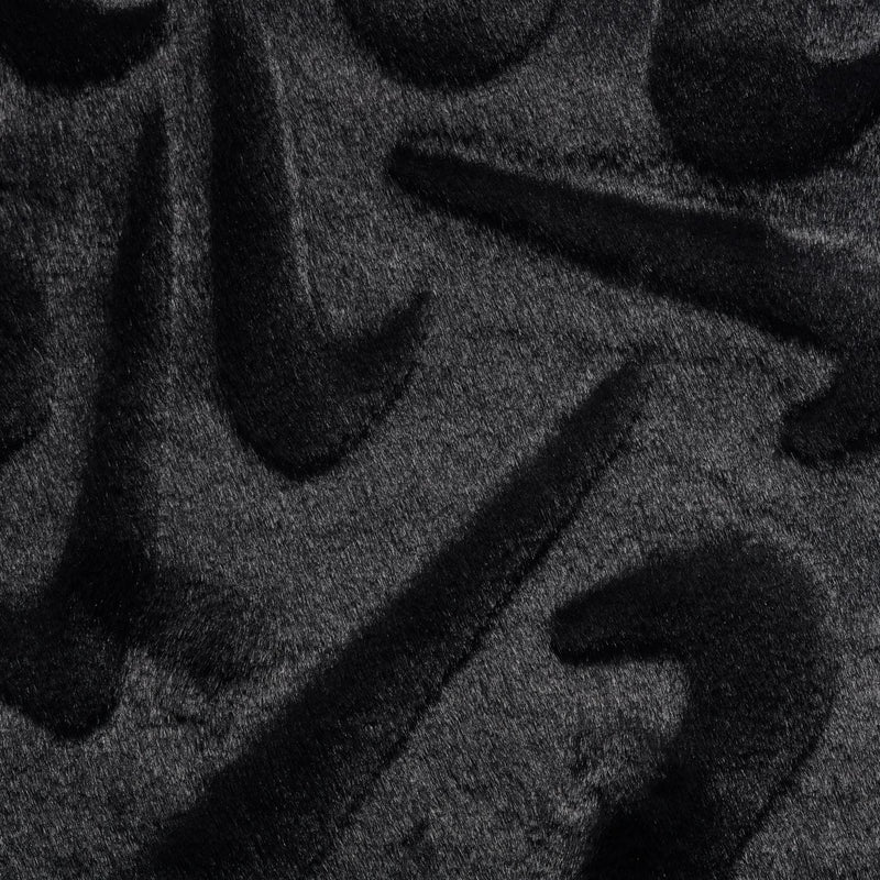 Black faux fur fabric with embossed swirl pattern texture.