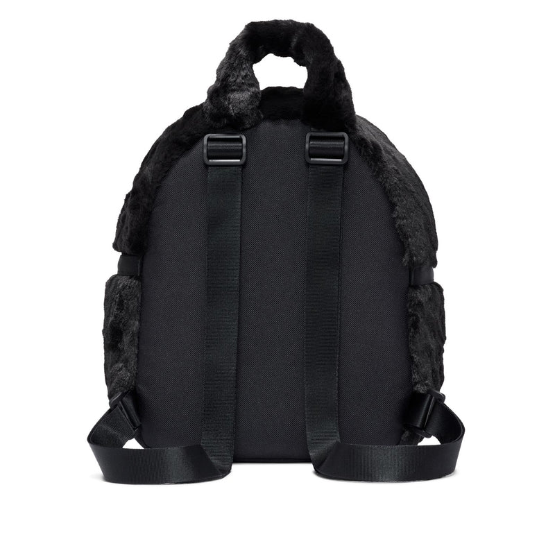 Black faux fur mini backpack with padded back, twin straps, and top handle.