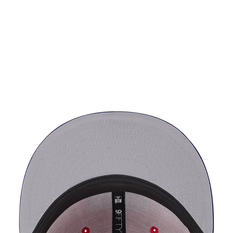 Two-tone cap interior with gray lining, black sweatband, and size label