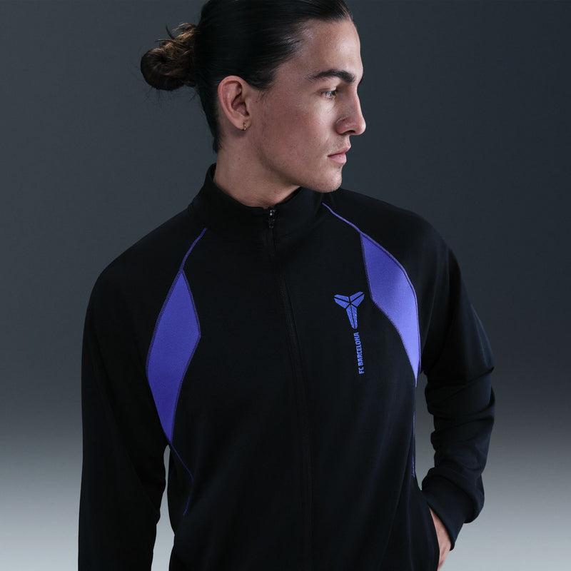 Men's black zip track jacket with purple angular panels and chest logo