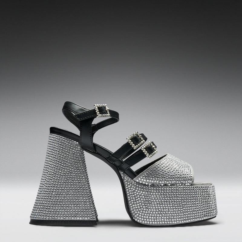 Black high-heeled sandal with crystal embellishments on a gray background