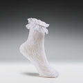 White lace sock on a gray background