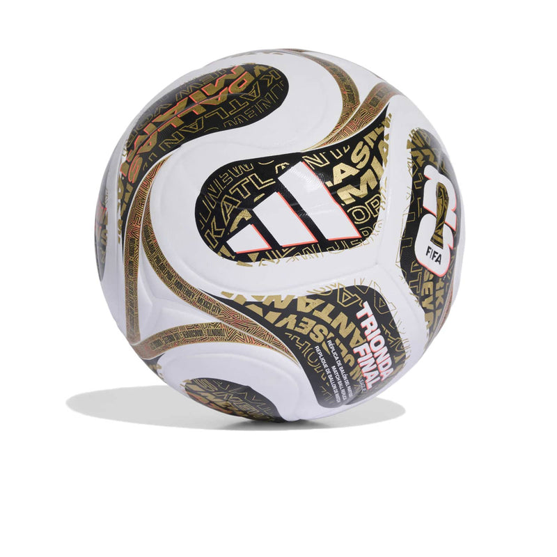 White and black soccer ball with gold graphics and FIFA logo panels
