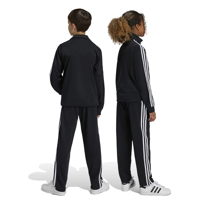 Youth black track pants shown from back with white side stripe panels
