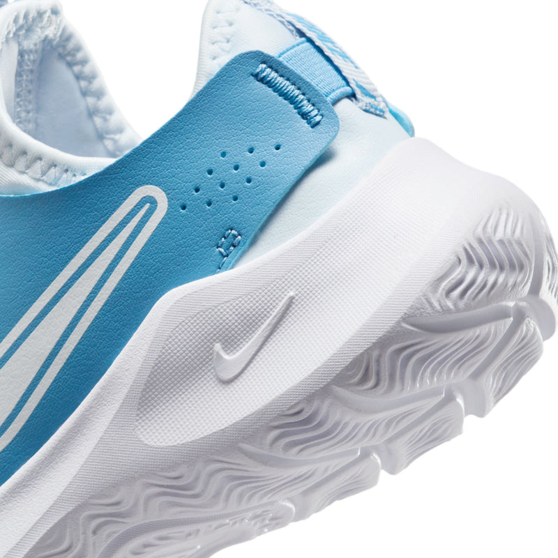 Kids running shoe close-up, textured white outsole with Swoosh logo