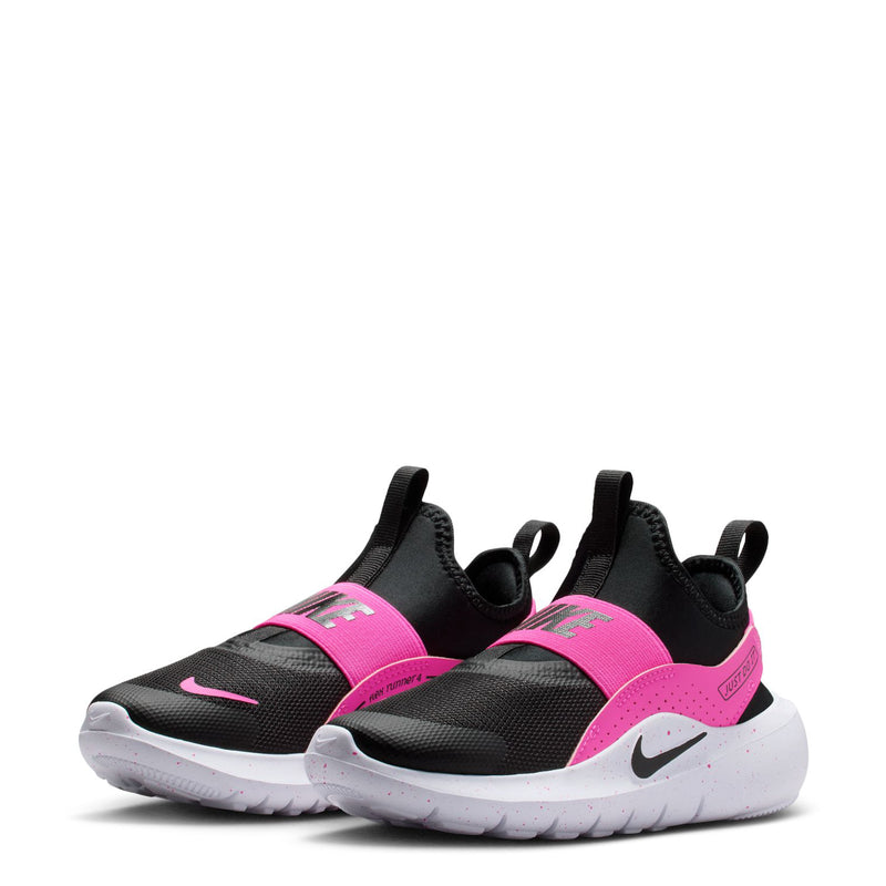 Pair of kids slip-on running shoes: black and laser fuchsia with white speckled sole.