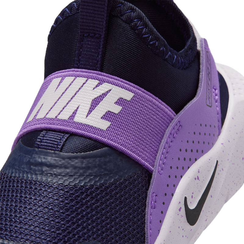 Toddler sneaker close-up, purple NIKE strap and dark navy mesh with perforations