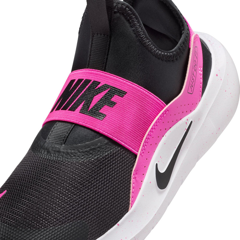 Youth shoe side close-up: black mesh upper with pink heel strap and white midsole