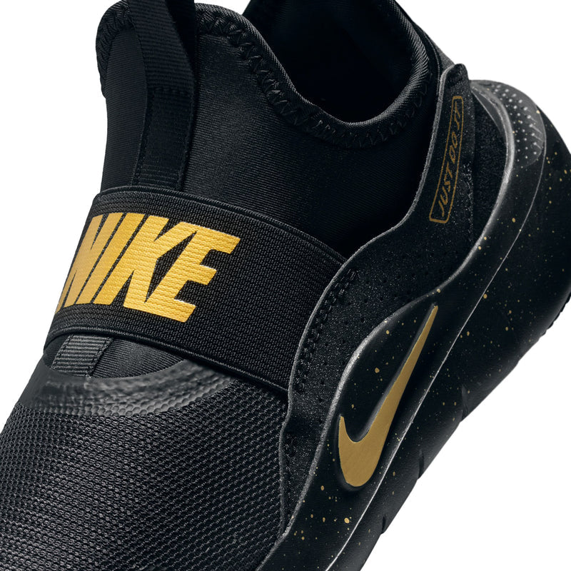 Youth black slip-on upper with gold strap detail and Nike Swoosh on knit