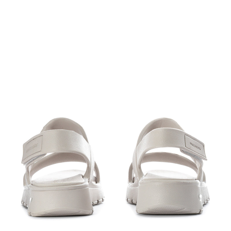 Women’s foam slide sandal, heel view, light neutral footbed and back strap