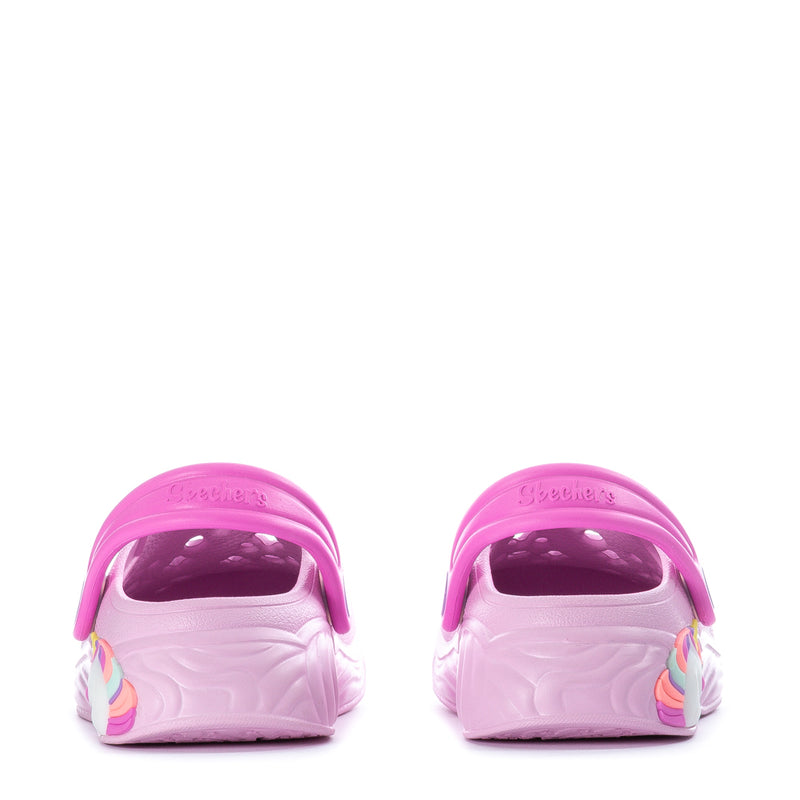 Pink toddler slip-on clogs with molded heel openings and bright pink back strap