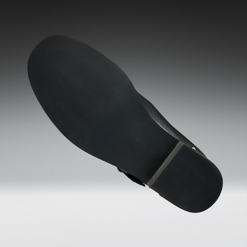 Black shoe sole on a gradient gray background