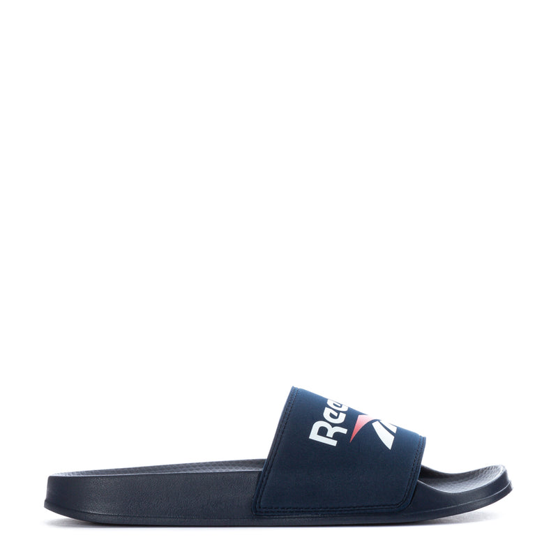 Men's navy slide sandals with wide strap and Reebok logo on the footbed