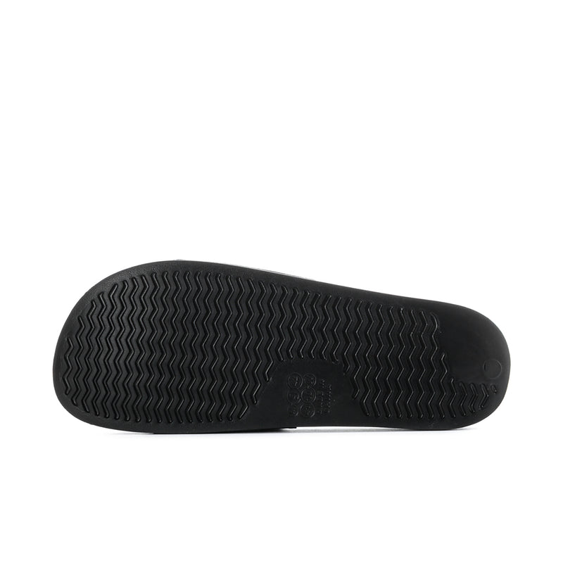 Men's black slide sandal outsole with textured tread pattern