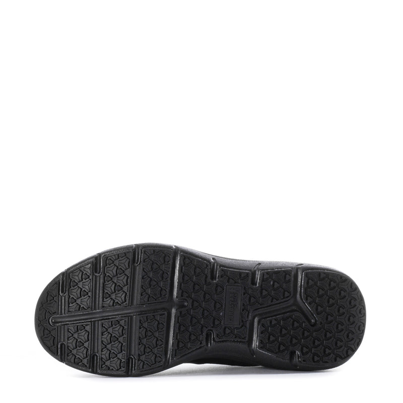 Black outsole with patterned traction tread on slip-on shoe.