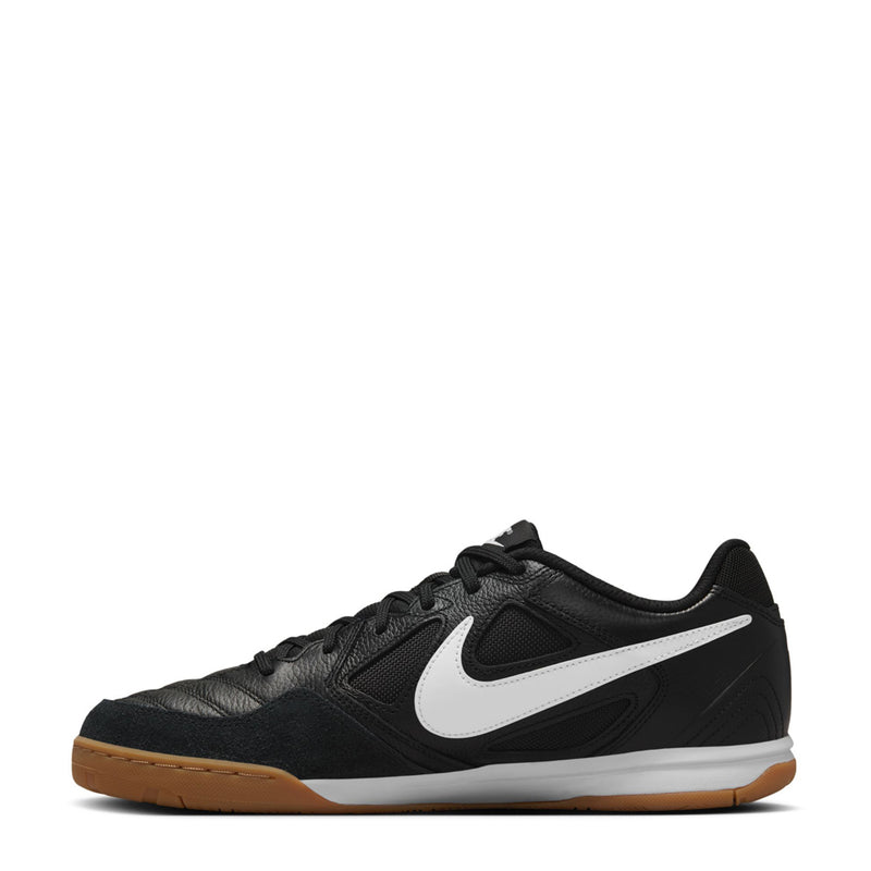 Black men's lace-up soccer shoe with white swoosh and gum sole, textured upper