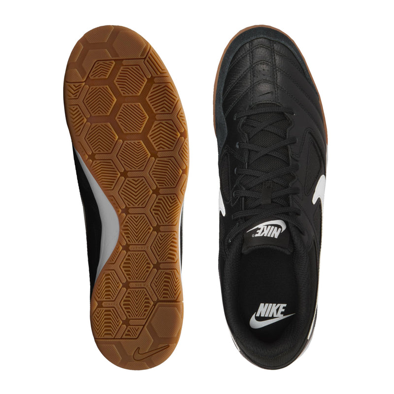 Black men's soccer shoe outsole tread with gum rubber base, heel and toe view