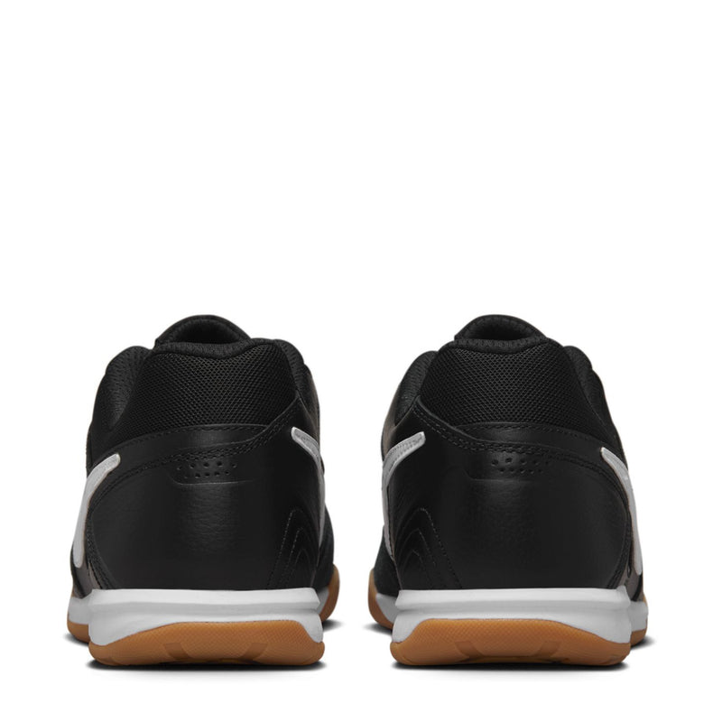 Black men's soccer shoe heel view with white stripe detail and gum sole, lace-up