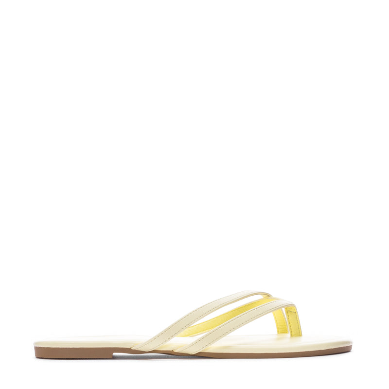 Women's yellow flip-flops with transparent strap and cushioned footbed