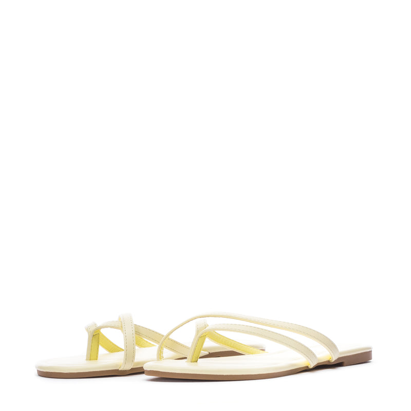 Women's yellow flip-flops with Y-shaped upper and flat thong-style sole