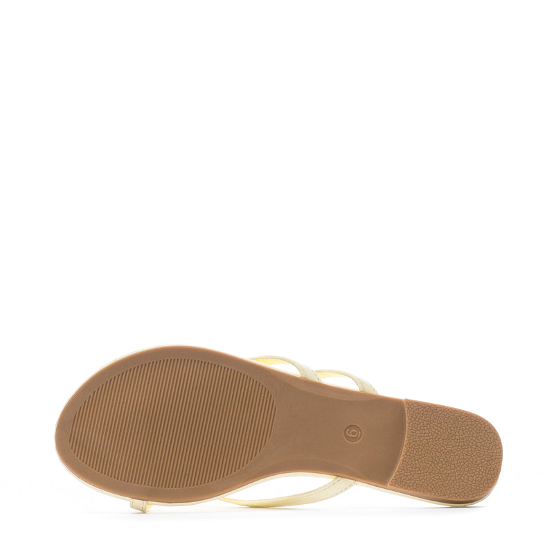 Women's yellow flip-flops outsole with textured tread and circular logo