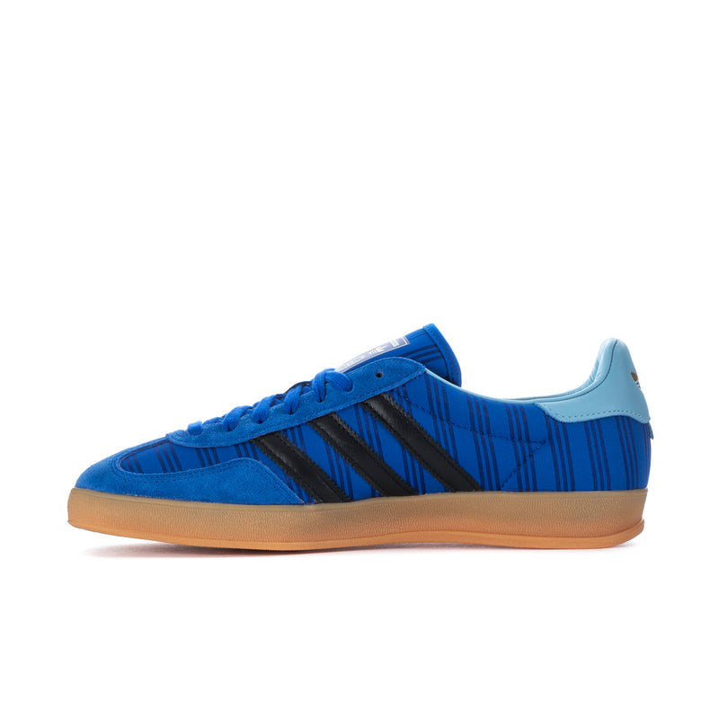 Men's blue indoor sneakers with lace-up front, black stripes, and gum sole