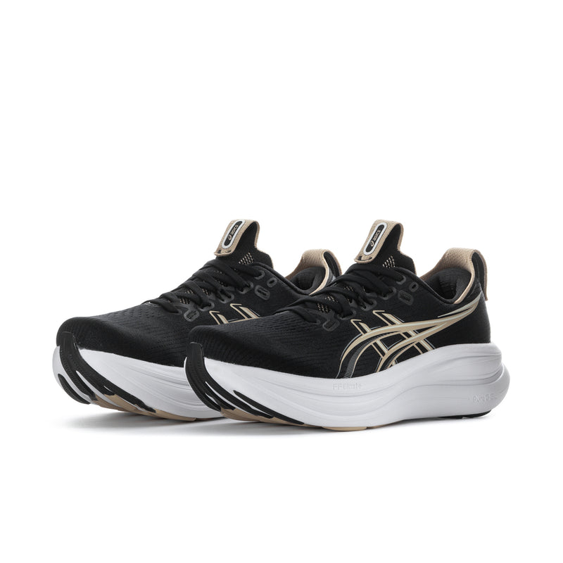 Pair of men's black running shoes with gold stripes and white midsoles