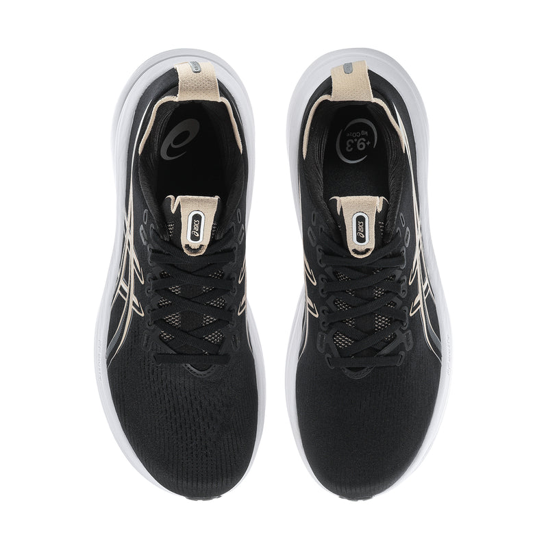 Pair of men's black running shoes with tan inner lining and white collars