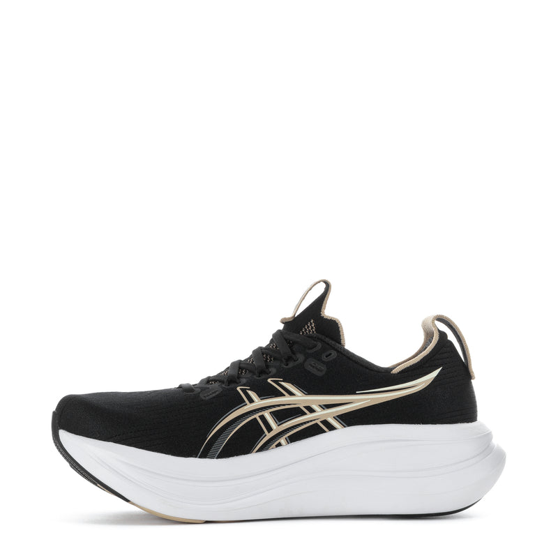 Women’s black running sneaker with gold side stripes, laces, and white platform sole