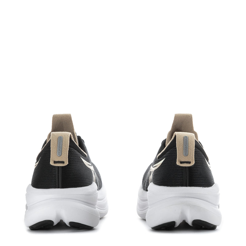 Women’s black running shoes with beige heel pull tabs and white cushioned soles