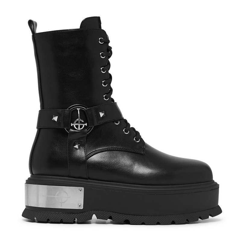Black platform boot with silver buckle and sole on a white background