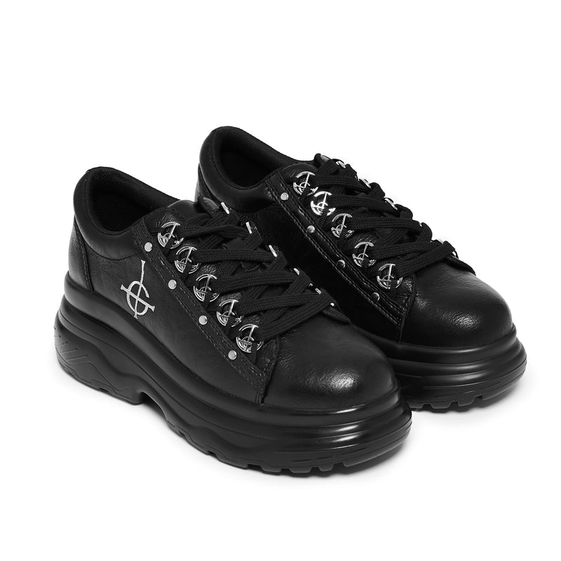 Pair of black sneakers with unique design on a white background