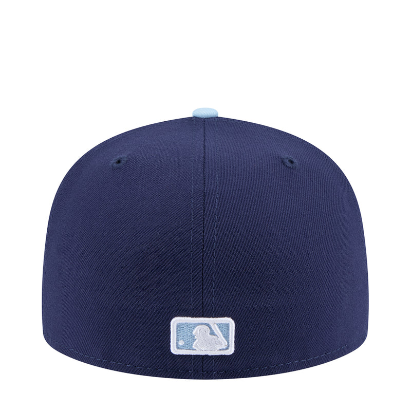 Two-tone baseball cap in dark navy with light blue brim and baseball glove patch
