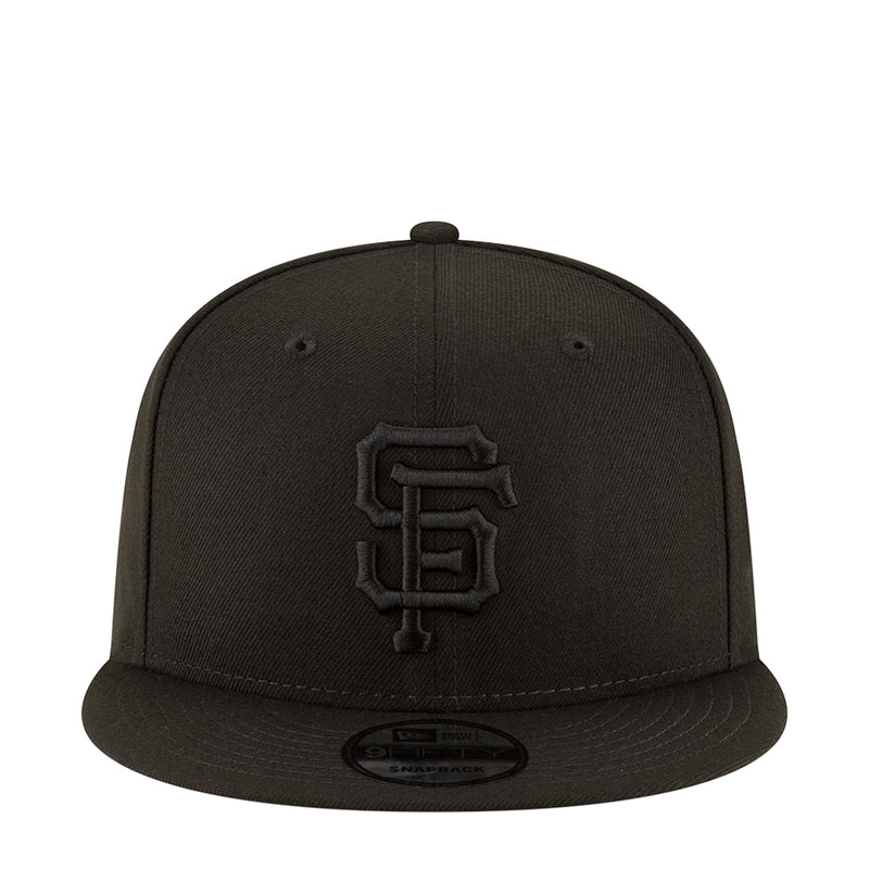 Black baseball cap with front Giants logo patch and curved brim