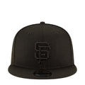 Black baseball cap with front Giants logo patch and curved brim