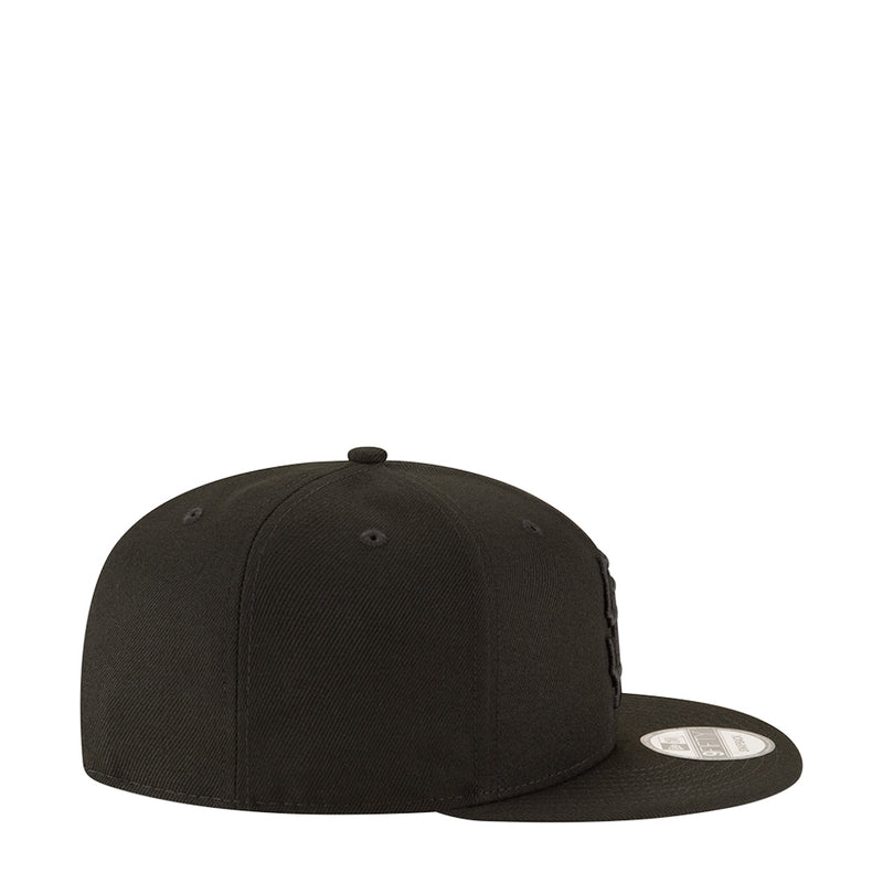 Black baseball cap side profile with small side logo and snapback strap