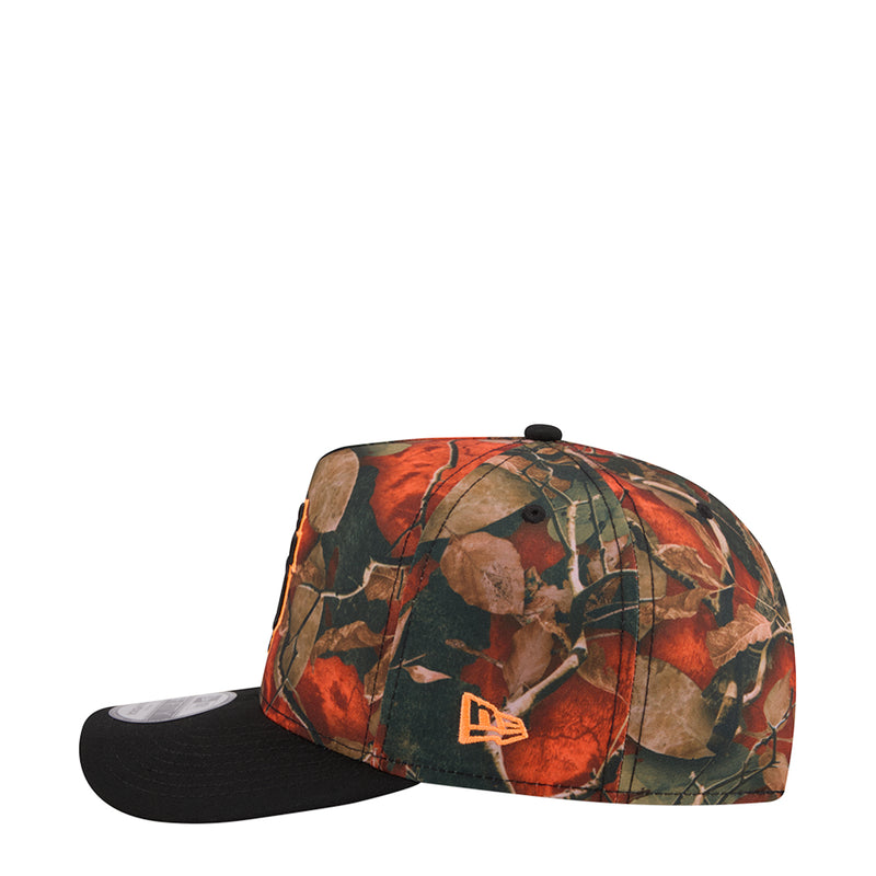 Two-tone A-frame cap with red/green leaf camo top and black brim, small orange logo