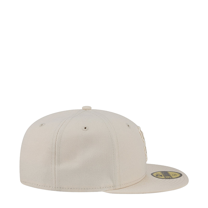 Light cream baseball cap, side view with small eyelets and minimal front logo