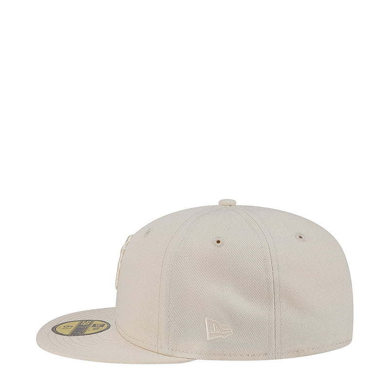 Light cream baseball cap, angled front view with small front emblem