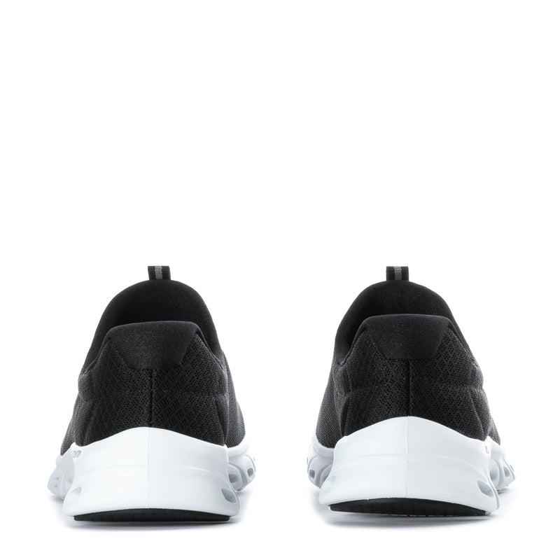 Black women's sneakers with white heel cushioning and rear loop detail