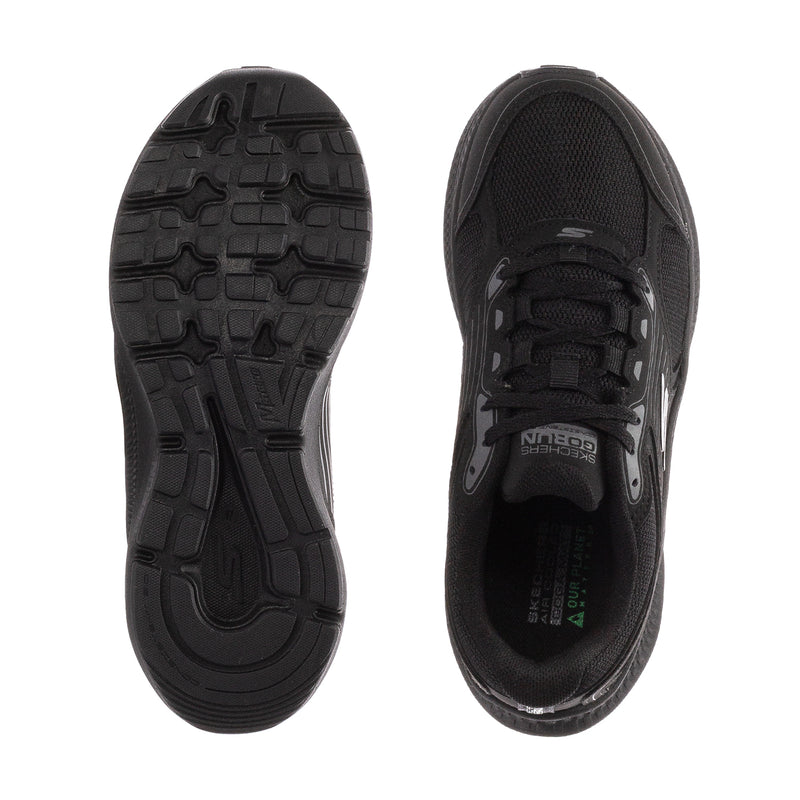 Black women's running shoe outsole and insole view, treaded rubber sole