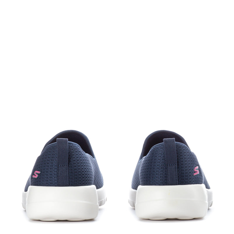 Women's navy slip-on sneakers with white midsoles, rear view