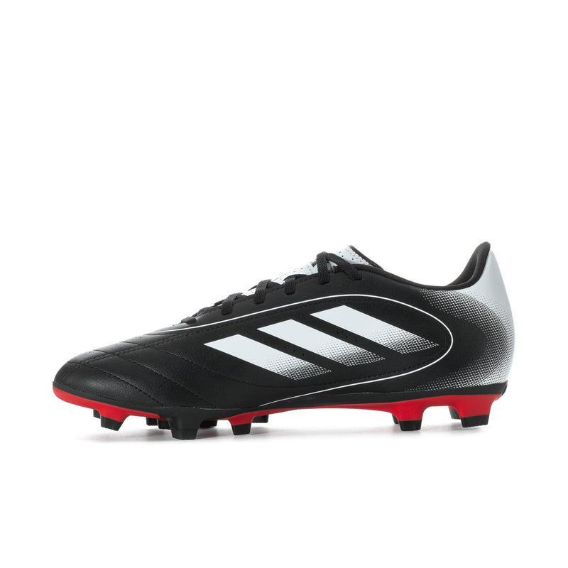 Men's black soccer cleats with white logo stripes and red outsole