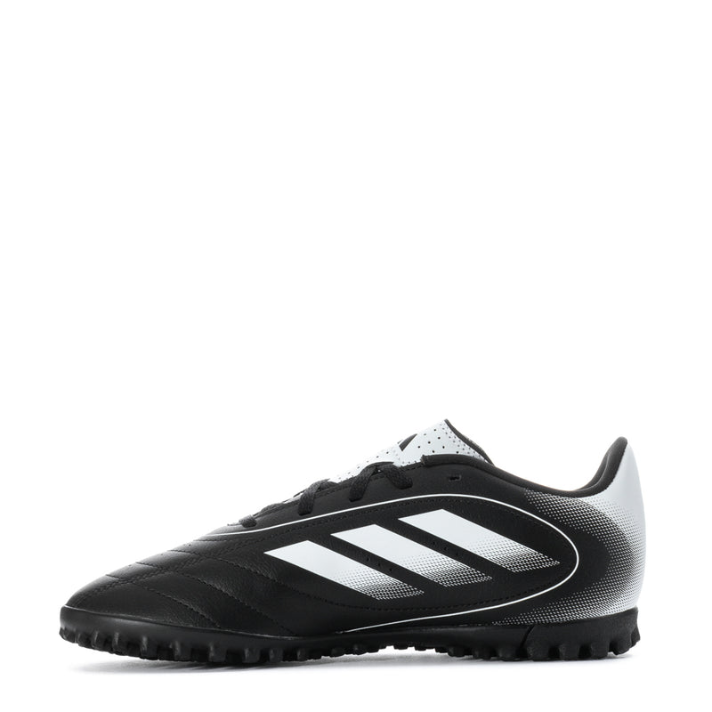Youth black-and-white turf soccer cleat side view with white stripes and studs